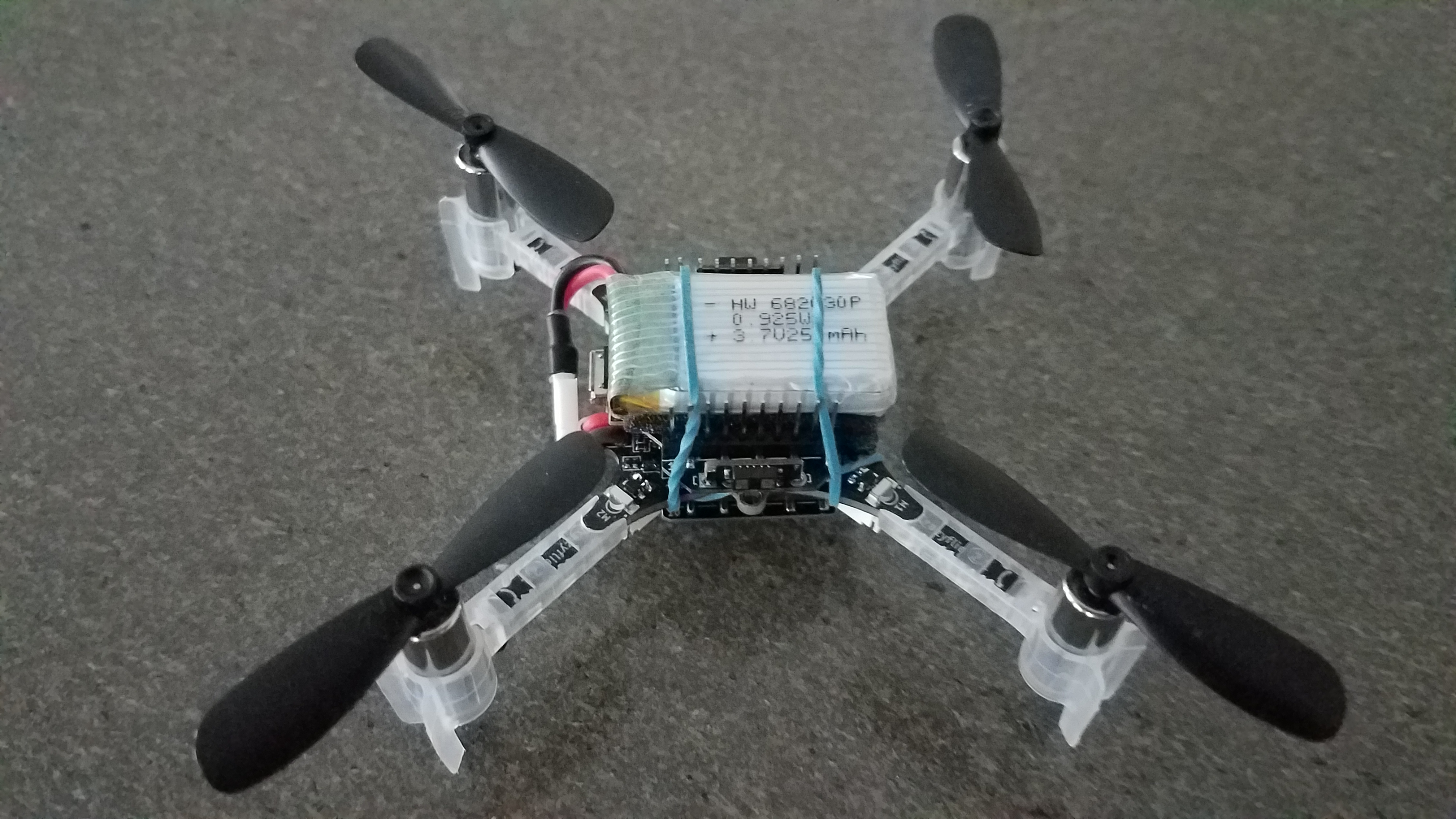 Crazyflie2.1 with flow-deck, multi-ranger deck, and battery setup suitable for hot-swap -- it's ready to fly hot_swap_arrangement